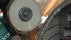 Close-up of worker cutting metal with grinder. Stock Footage