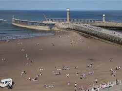 BEACH TWIN PIERS AND ENTRANCE TO HARBOUR Stock Footage