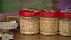 Spices in labeled jars line a table at a spice market in Kochi, India. Stock Footage