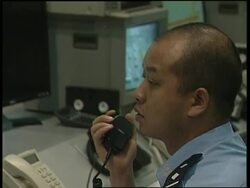 WRAP Olympic test bans cars from streets ADDS traffic controller News Clip