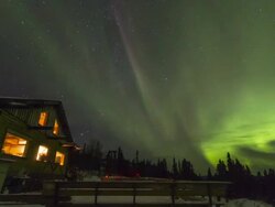 Shot of aurora polaris and a lodge at night Stock Footage