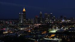 Elevated view over Interstate 85 passing the Downtown Atlanta skyline, Georgia, United States of America Stock Footage