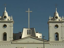 "Central view of large cross and bell towers at the top of Cathedral Church of Chachapoyas [LA IGLESIA CATEDRAL DE CHACHAPOYAS], blue skies, Plaza De La Armas, Chachapoyas, Peru [PerÃƒÂº]" Stock Footage