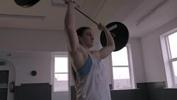 Professional Female Powerlifter Doing Overhead Press Stock Footage