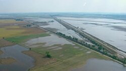 Freeways cross over flooded farm fields in Louisiana. Stock Footage