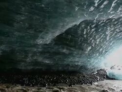 MS TU Shot of melted glacier stream and fallen glaciers inside of glacier cave / Iceland Stock Footage