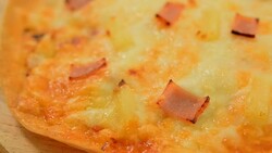 Hawaiian pizza served on a wooden tray Photo Brown. Stock Footage