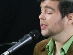 Musician sings into microphone Stock Footage