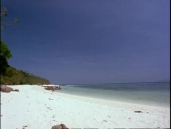 WA Person walking along tropical beach, Thailand Stock Footage