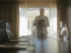 MS PAN Man working on ipad in meeting room / Seattle, WA, United States Stock Footage