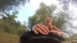 POV Dog pulling toy rope with female owner Stock Footage