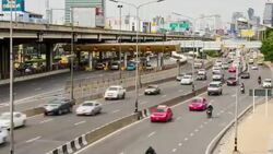 Traffic jam on highway, rush hour busy traffic driving on highway tilt down shot Stock Footage