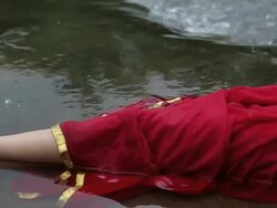 Woman lying on water, Malshej Ghat, Maharashtra, India Stock Footage