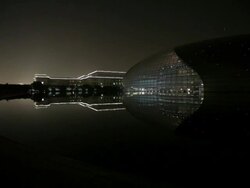 WS Great Hall of the People next to National Grand Theater at night / Beijing, China Stock Footage