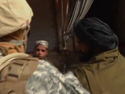 MS ZI PAN Soldiers talking to civilians / Musa Qala, Helmand Province, Afghanistan. Stock Footage