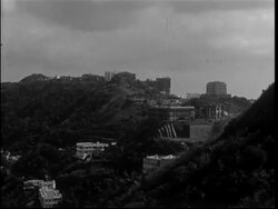 HONG KONG, 1950, views from Victoria Peak over harbour towards Kowloon; cannon on moutain side; view south over Ap Lei Chau. Stock Footage