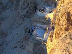 WS AERIAL POV Cave on mountain/ Masada, Sourn Judea Desert, Israel  Stock Footage