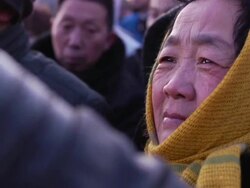 Tourists watching flag raising ceremony in Tiananmen Square News Clip