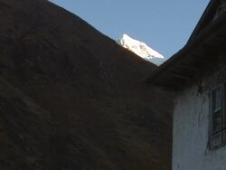 Mount Everest glimpsed as the morning sun illuminates its face. Stock Footage