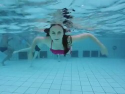 Young woman waving hand underwater Stock Footage