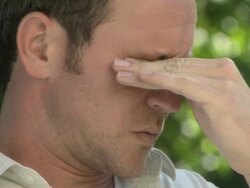 Man rubbing his eyes Stock Footage
