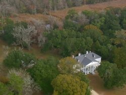 MS AERIAL ZO Shot of Hampton Plantation State Park surrounded by wooded area / South Carolina, United States Stock Footage