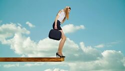 Woman walking on edge of plank Stock Footage