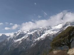WS PAN View of Kongde-Ri Mountain Range with flags at hotel / Mende, Khumbu Region, Nepal Stock Footage