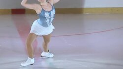 SLO MO TS Female figure skater skating performing Stock Footage
