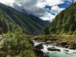 Time-lapse of a river and a trail in a Himalayan valley. Stock Footage