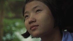 C/U portrait of Myanmar teenage girl under rain Stock Footage