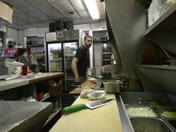 MS Cook fliping eggs at classic American diner / Ann Arbor, Michigan, United States Stock Footage
