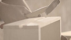 Carpenter hammering nail, creating wooden crate Stock Footage