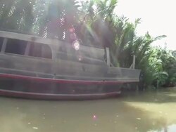 LA POV from small boat as it travels the Mekong River near Saigon / Vietnam Stock Footage