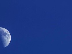 moon moving on blue sky Stock Footage