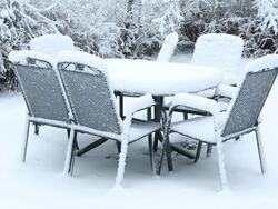 MS Snow covering on garden furniture / Saarburg, Rhineland-Palatinate, Germany Stock Footage