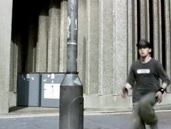 Medium shot freerunner swinging on pole Stock Footage