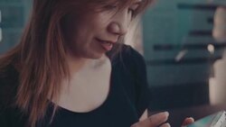 Asian woman texting on her smart phone Stock Footage