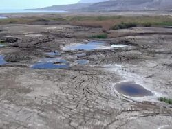 MS AERIAL Sinkholes formed by continuing sea level drop near  dead sea /  Norrn Judea Desert, Israel Stock Footage