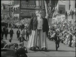 A parade with an Uncle Sam parade float celebrates Franklin D. Roosevelt's inauguration day in 1941. News Clip