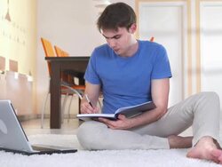 HD DOLLY: Student Using Laptop For Homework Stock Footage