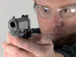 Loading and aiming 45 pistol Stock Footage