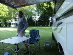 WS mature man reading and drinking tea in front of  camper van/Bungay/Suffolk/UK Stock Footage