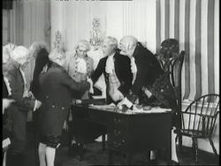 Actors impersonating the Founding Fathers reenact the signing of the Declaration of Independence. News Clip