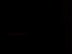 Car weaving on road at night Stock Footage