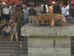 WS Group of men mourning beside funeral pyre / Kathmandu, Central Region, Nepal Stock Footage