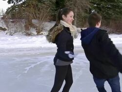 Young adult couple skating together on the ice.. Stock Footage