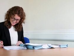 Female lawyer signing documents Stock Footage