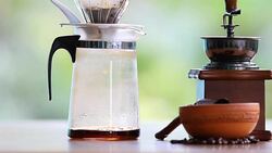 Drip coffee Process. Pouring a boiling water over the grounds. Stock Footage