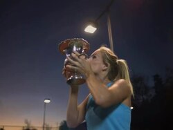 CU, LA, Young female tennis player holding trophy, dusk, Santa Barbara, California, USA Stock Footage